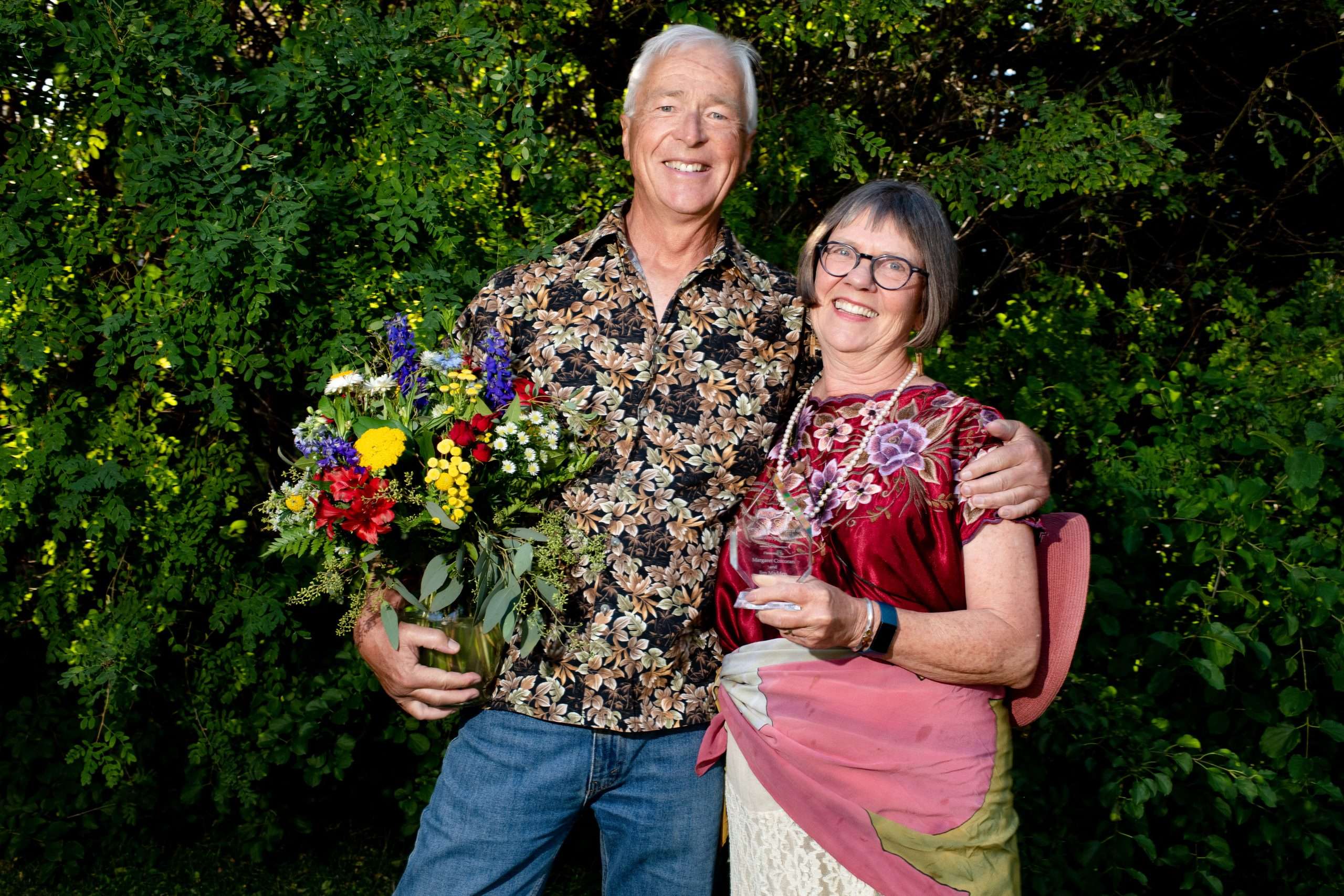 Margaret Corcoran and Jim Madden pose with the Steve Browning “Spirit of Philanthropy” Award for 2022